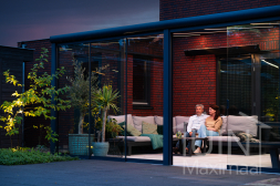 Gumax® Lighting System with glass patio doors in a modern anthracite-coloured veranda