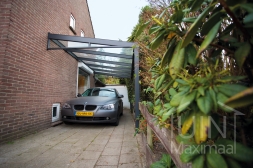 Modern Gumax attached carport with glass wedge