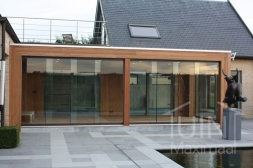 Glass sliding doors in existing modern wooden veranda