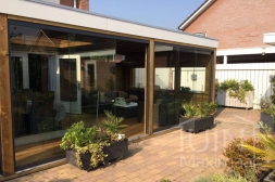 Glass sliding doors in existing veranda