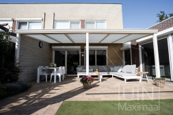 Matt white veranda with sun shading and a classic gutter style.