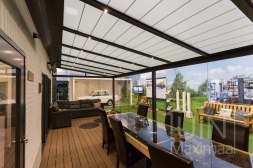 Pergola with sun shading and glass sliding doors