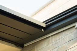 Gumax electric underdeck sun shading in matt anthracite detailed photo of the storage box